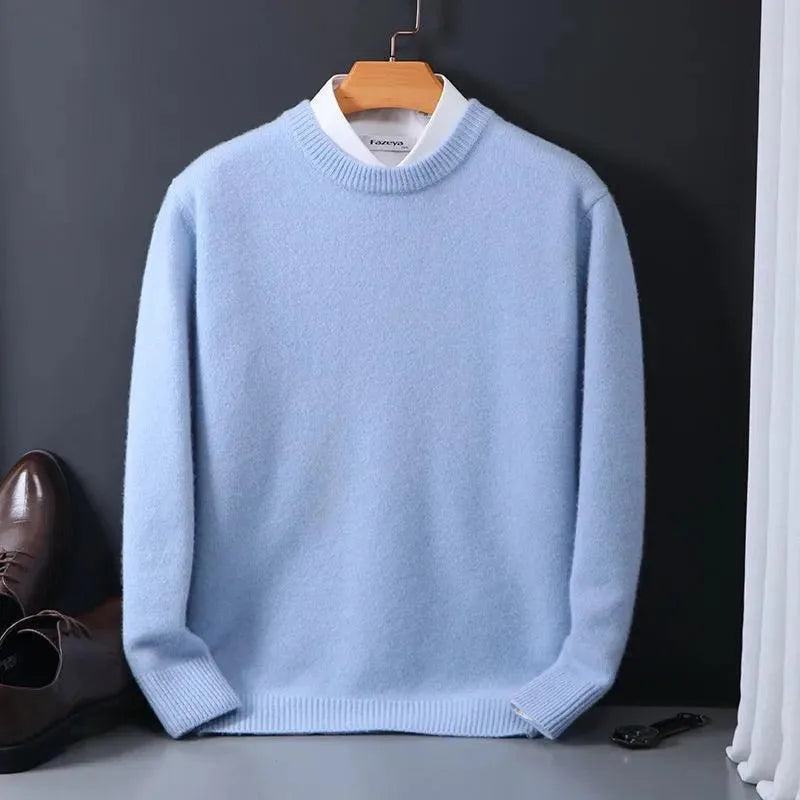 Light blue knitted jumper with mock shirt collar, hanging against a dark grey backdrop with shoes below