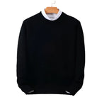 Front view of the black knitted jumper on a plain white background, showing the ribbed collar and cuffs