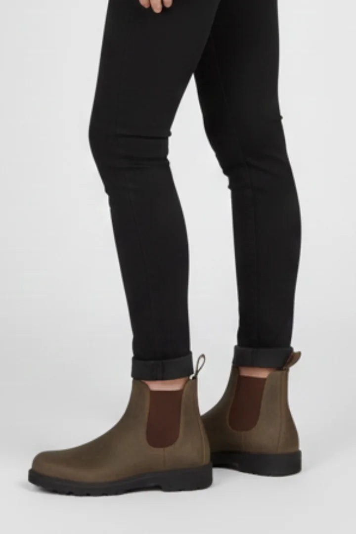Profile view of a brown Chelsea boot with visible stitching, elastic panel and chunky sole unit