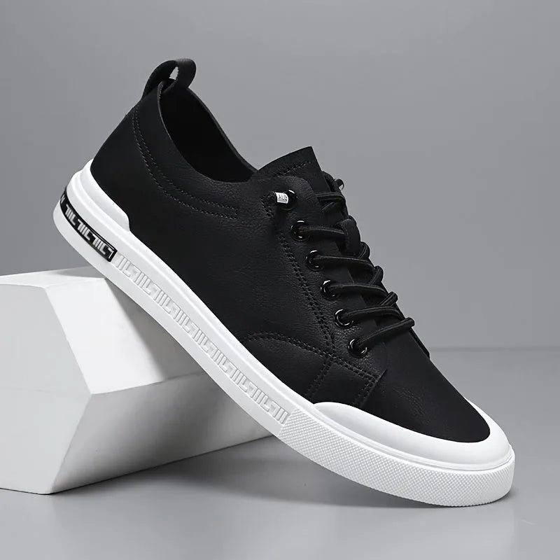 Side profile of a black leather trainer with lace-up closure and contrasting white textured outsole