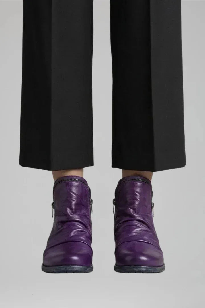 Front view of the same ankle boot style in a rich purple leather with ruched shaft