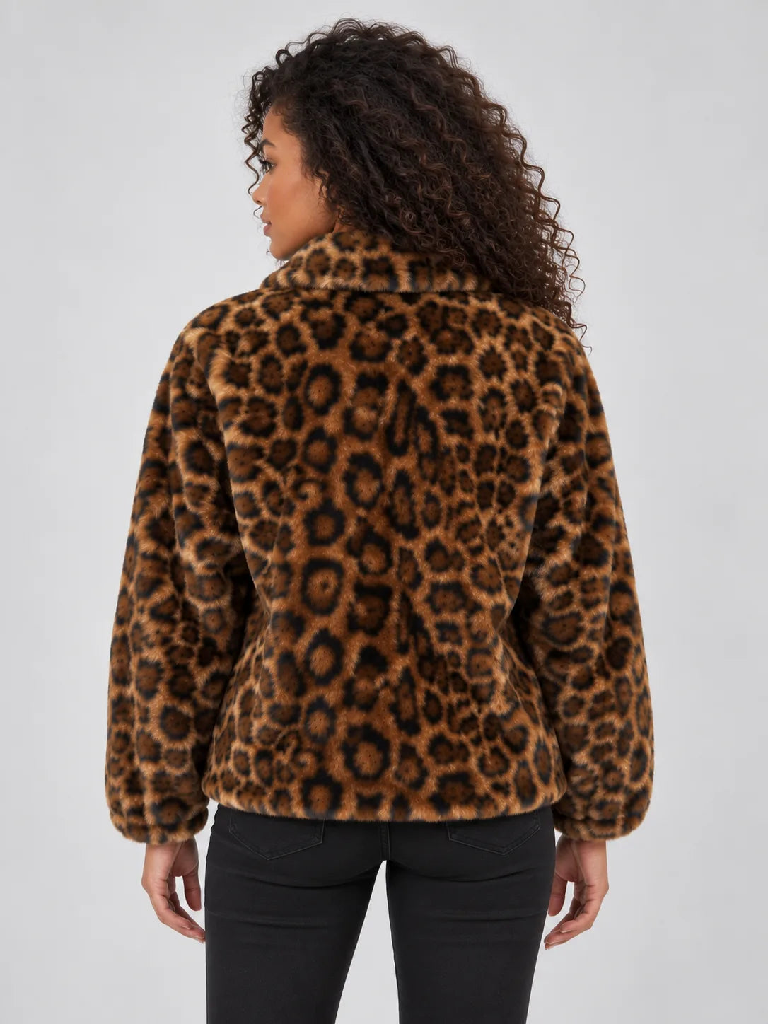 Back view of the leopard print faux fur jacket showing the plush textured finish across the shoulders and sleeves