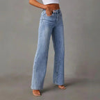 Close-up of the waistband and pocket detail on the high-waisted light blue denim trousers