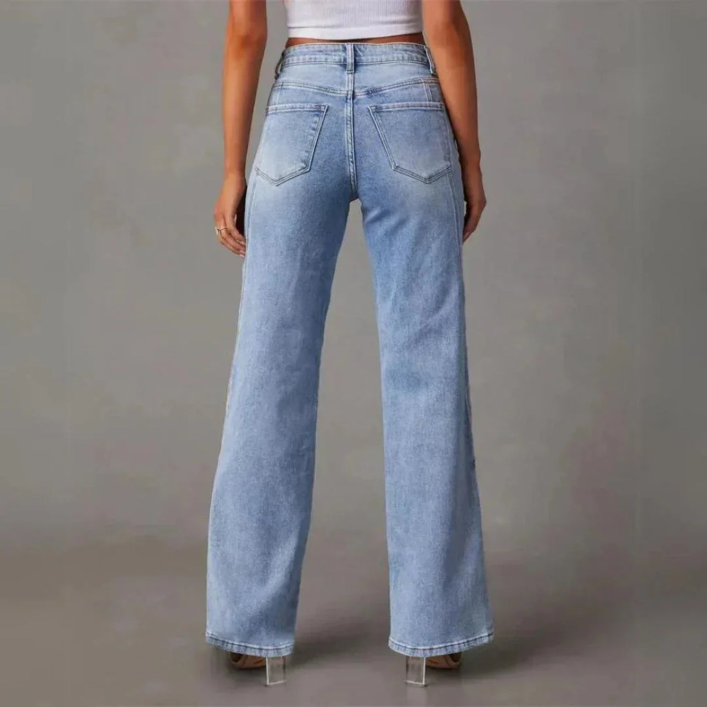 Back view of the light blue wide-leg jeans showing classic five-pocket styling and clean silhouette