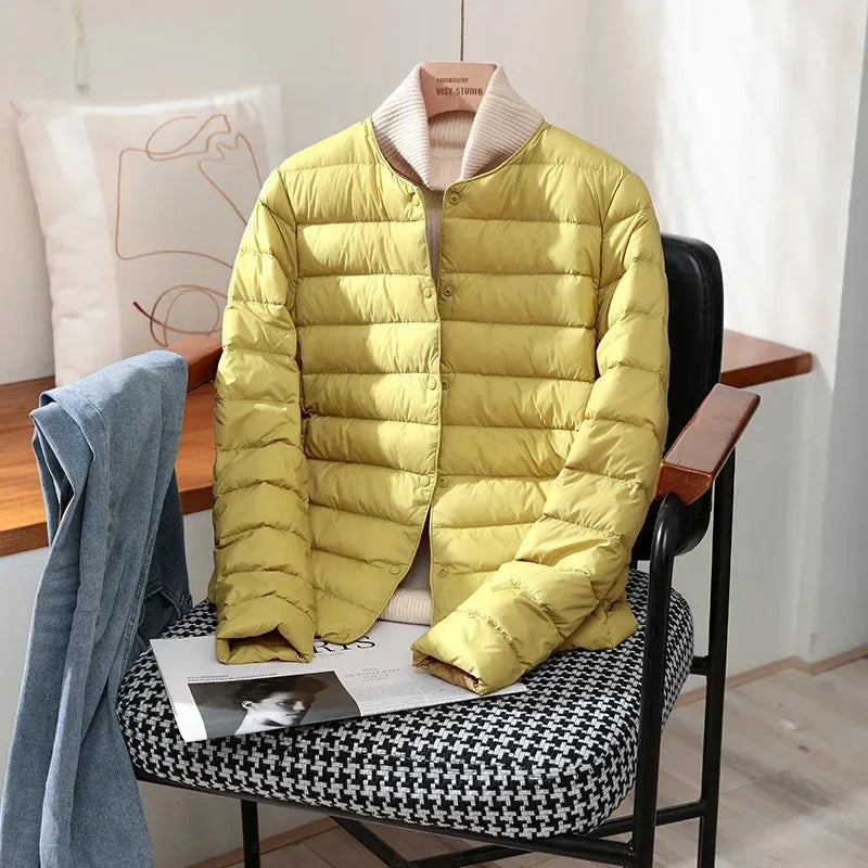 Close-up of the pale pink jacket collar and quilted channel texture on the shoulder