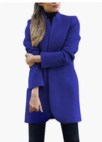 Vibrant blue longline blazer coat shown front on with sleeves gently folded at the cuff