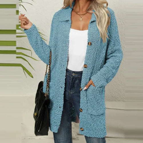 Light blue longline teddy cardigan jacket worn open over a white top, showing collar and button-front placket detail.