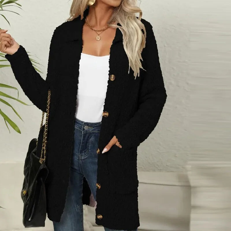 Black textured teddy longline jacket worn open, front view showing patch pockets and horn-style buttons.