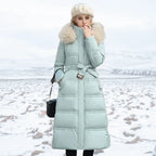 Detail view of the horizontal quilted panels and side pocket on the longline puffer coat
