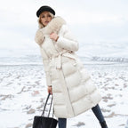 Side profile of the black longline puffer coat highlighting the quilted sleeve and zip detail