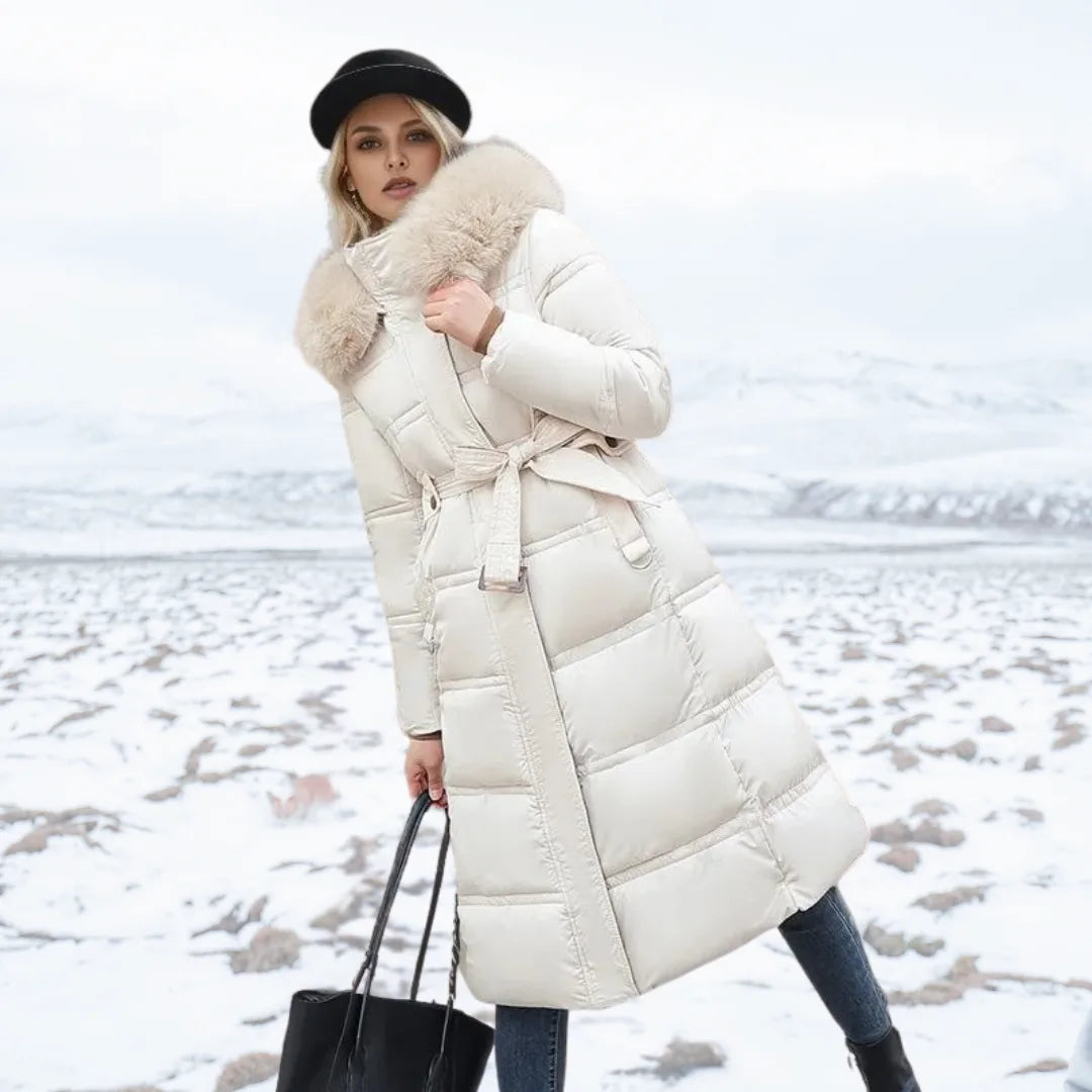 Side profile of the black longline puffer coat highlighting the quilted sleeve and zip detail