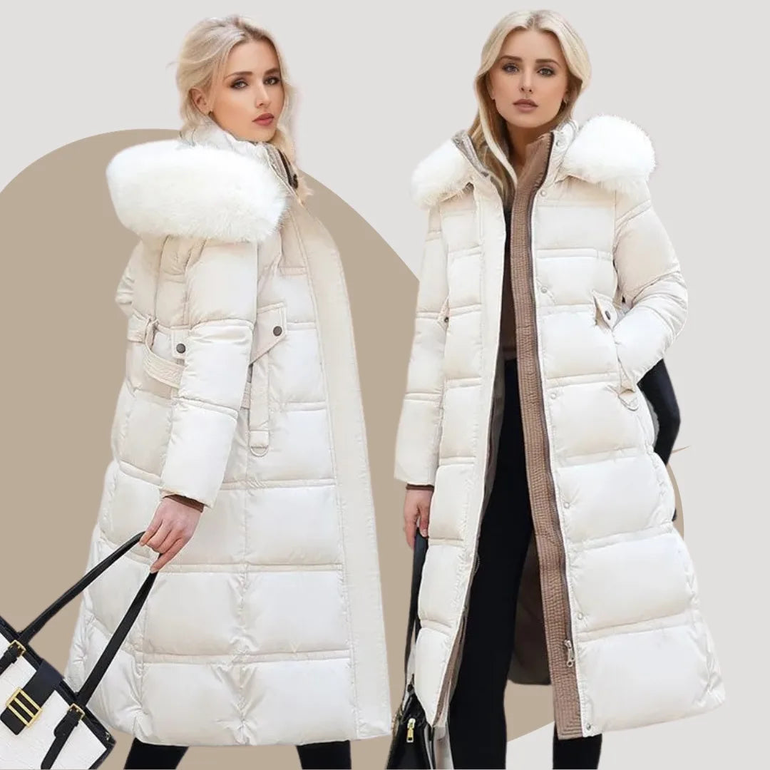 Woman walking outdoors in the black fur-hood puffer coat showing the coat's flowing maxi length