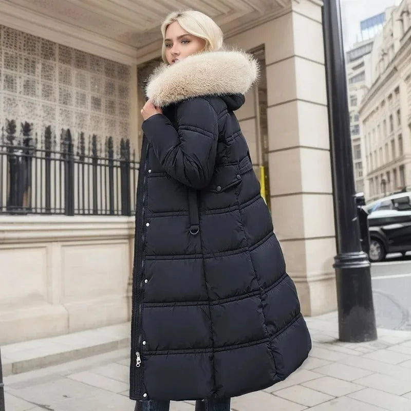 Rear side view of black quilted coat with cream fur hood walking past a city storefront