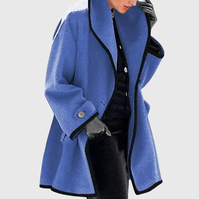 Blue shawl collar coat with black piping, mid-thigh length and button-through cuff detail