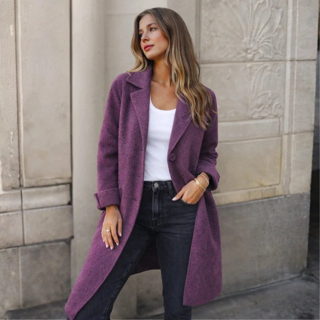 Purple wool longline coat with wide lapels and turned-back cuffs styled with a white top
