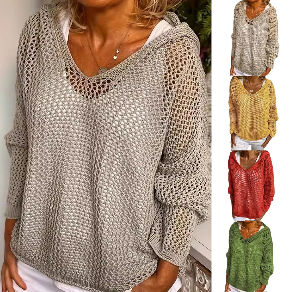 Model wears a light khaki open-knit hooded jumper layered over a white top, front view with necklace detail