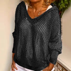 Product shot of the khaki open-knit hooded jumper on a model, three-quarter front view