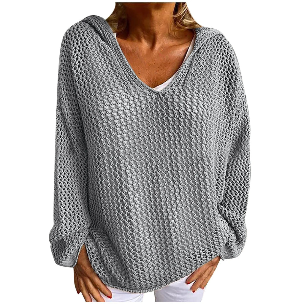 Flat lay style product shot of the grey open-knit hooded jumper on a plain background