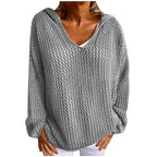 Flat lay style product shot of the grey open-knit hooded jumper on a plain background