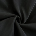 Close-up texture of the smooth black faux leather material, shown draped and folded