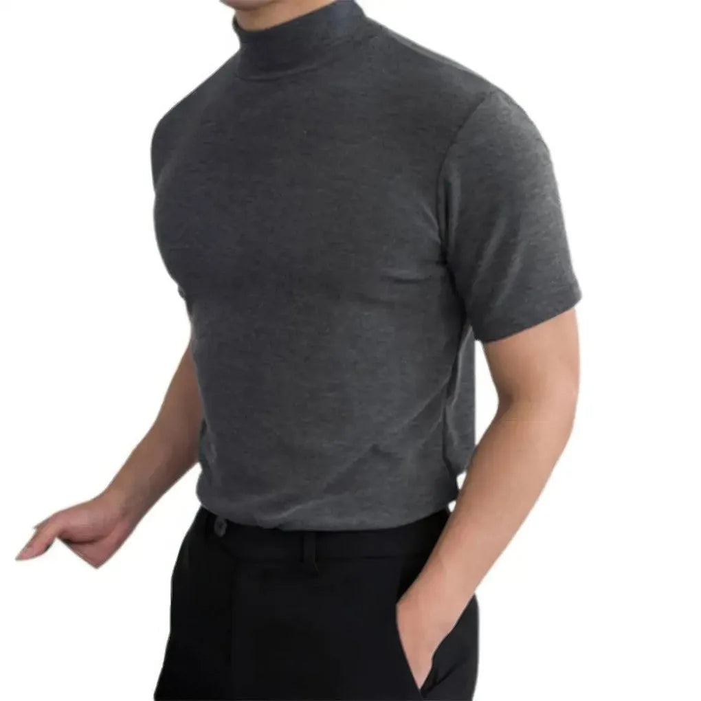 Side profile of a man wearing a grey marl mock-neck short-sleeve top with slim fit through the body and sleeves.