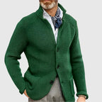 Side angle of the navy cardigan highlighting the ribbed knit texture across the sleeve