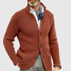 Detail shot of the button placket and knit texture on the beige cardigan