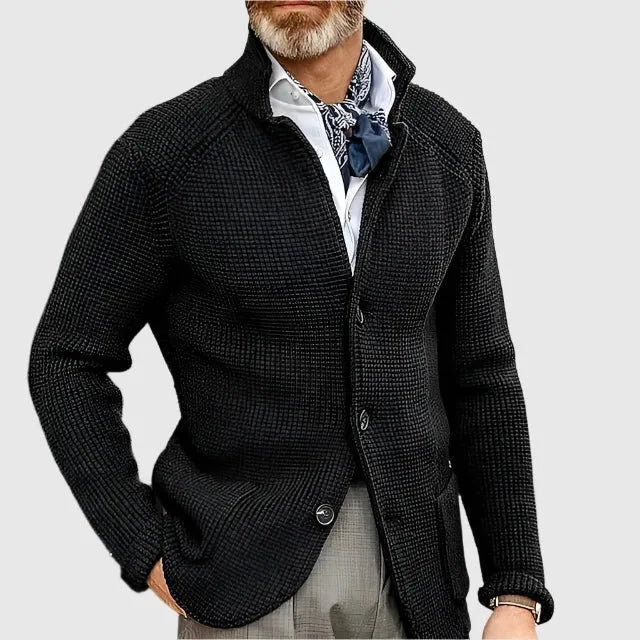 Side profile of the blue knit cardigan showing the stand collar and sleeve seam detail