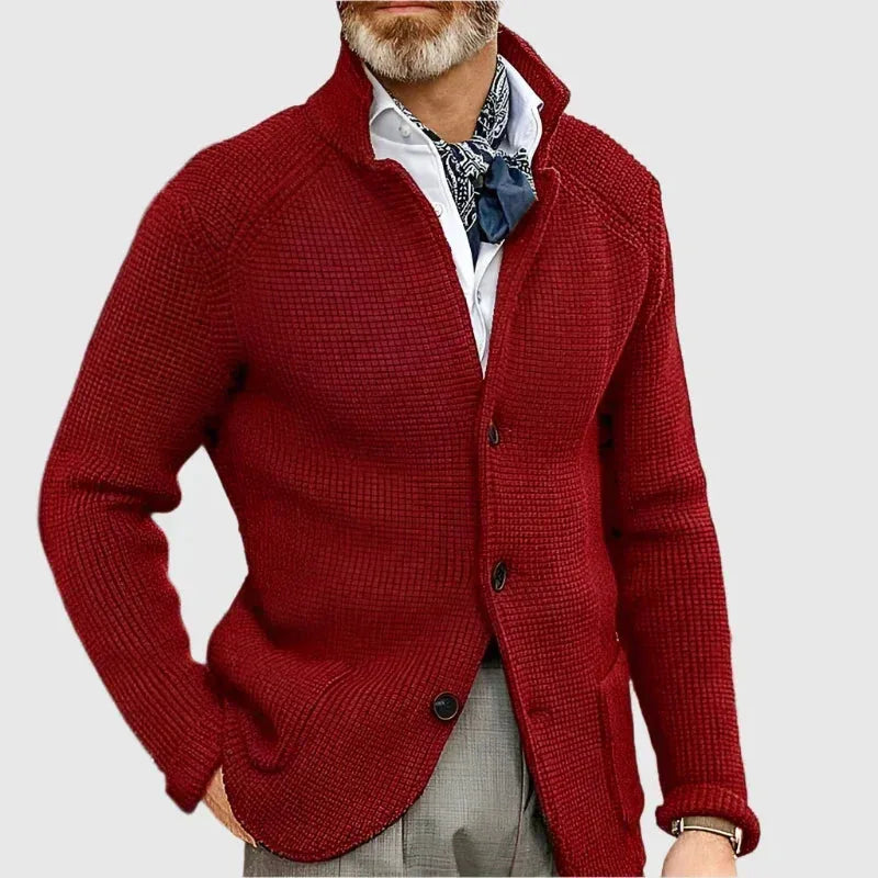 Front view of the navy knit cardigan showing all three buttons fastened and raglan sleeve seams