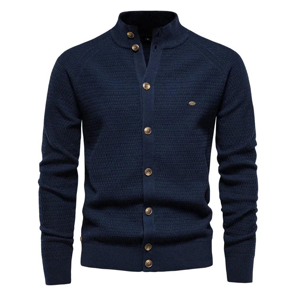 Navy blue cardigan close-up styled view showing textured knit pattern and gold-tone buttons