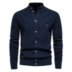 Navy blue cardigan close-up styled view showing textured knit pattern and gold-tone buttons