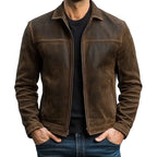 Front view of brown leather jacket worn open over a black jumper, showing collar and zip fastening