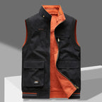 Black cotton gilet with contrast burnt orange lining, zip pulled down, showing chest and lower patch pockets