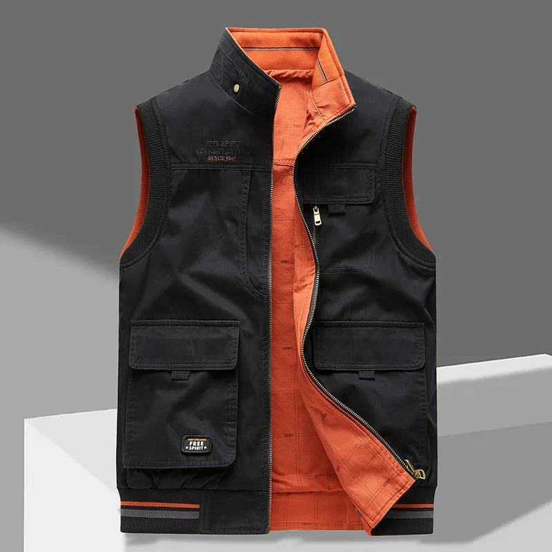Black cotton gilet with contrast burnt orange lining, zip pulled down, showing chest and lower patch pockets