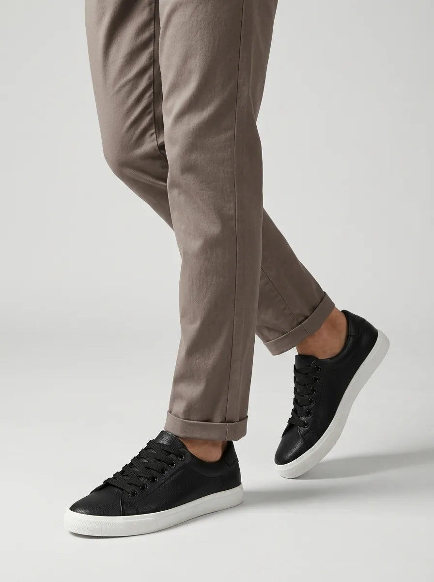 Front angle of white lace-up trainers with white outsole and toe cap detail