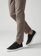 Front angle of white lace-up trainers with white outsole and toe cap detail