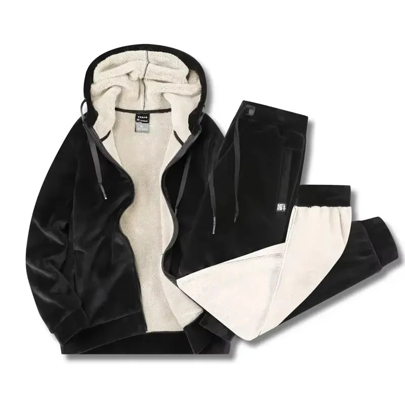 Black hooded jacket and joggers laid flat, unzipped to reveal the cream sherpa fleece interior