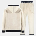 Back view of the cream sherpa fleece hoodie and matching joggers with navy cuffs and waistband