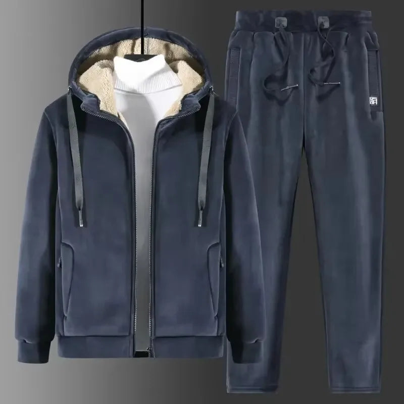 Navy blue tracksuit with hood up over a white jumper, shown on a hanger with drawstring joggers