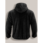 Back view of a black fleece zip-up hoodie showing the attached hood and relaxed shoulder fit