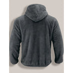 Back view of a charcoal grey fleece zip-up hoodie highlighting the plush textured fabric and hood shape