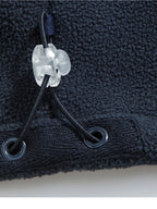 Close-up of the adjustable drawcord and toggle at the jacket hem
