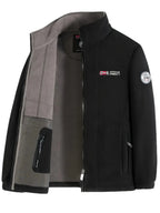 Black fleece zip-up jacket shown open, revealing the grey lining, mesh pocket and sleeve badge