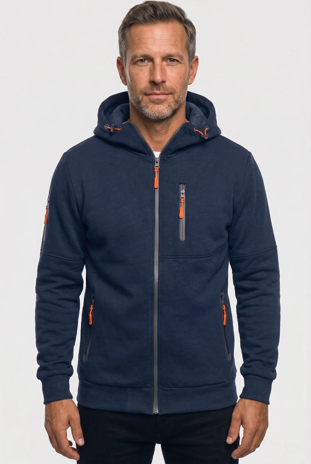 Front view of a man wearing a navy blue full-zip hoodie with orange zip pulls and a drawstring hood