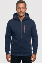 Front view of a man wearing a navy blue full-zip hoodie with orange zip pulls and a drawstring hood