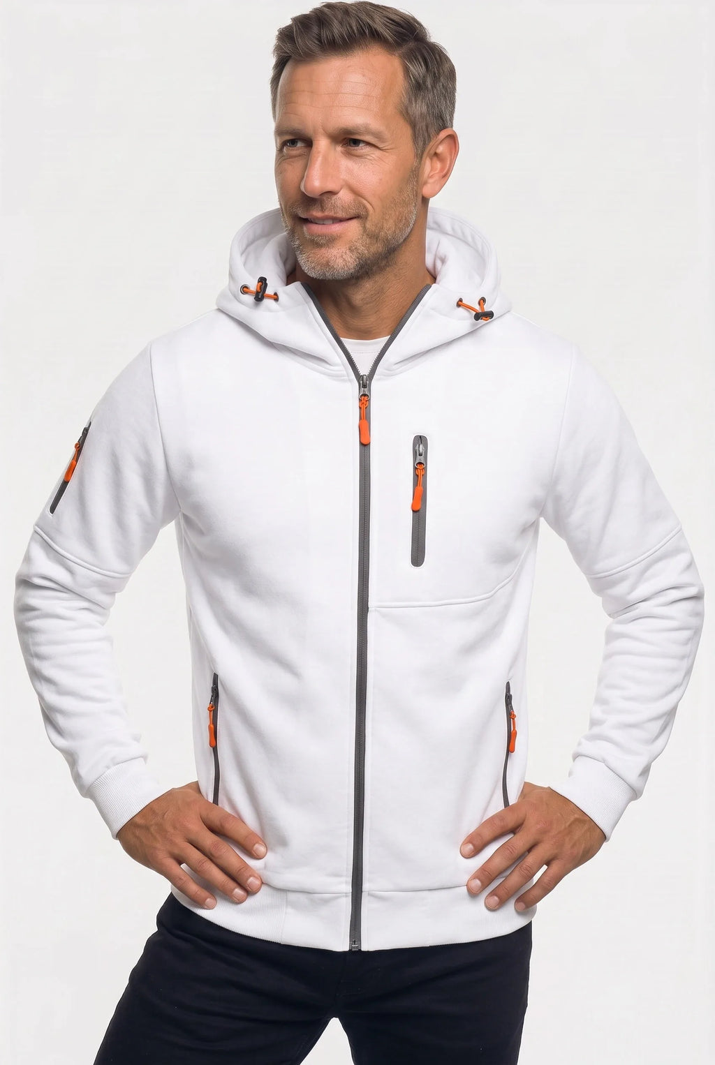Front view of a man wearing a white full-zip hoodie with grey zip trims and orange zip pulls