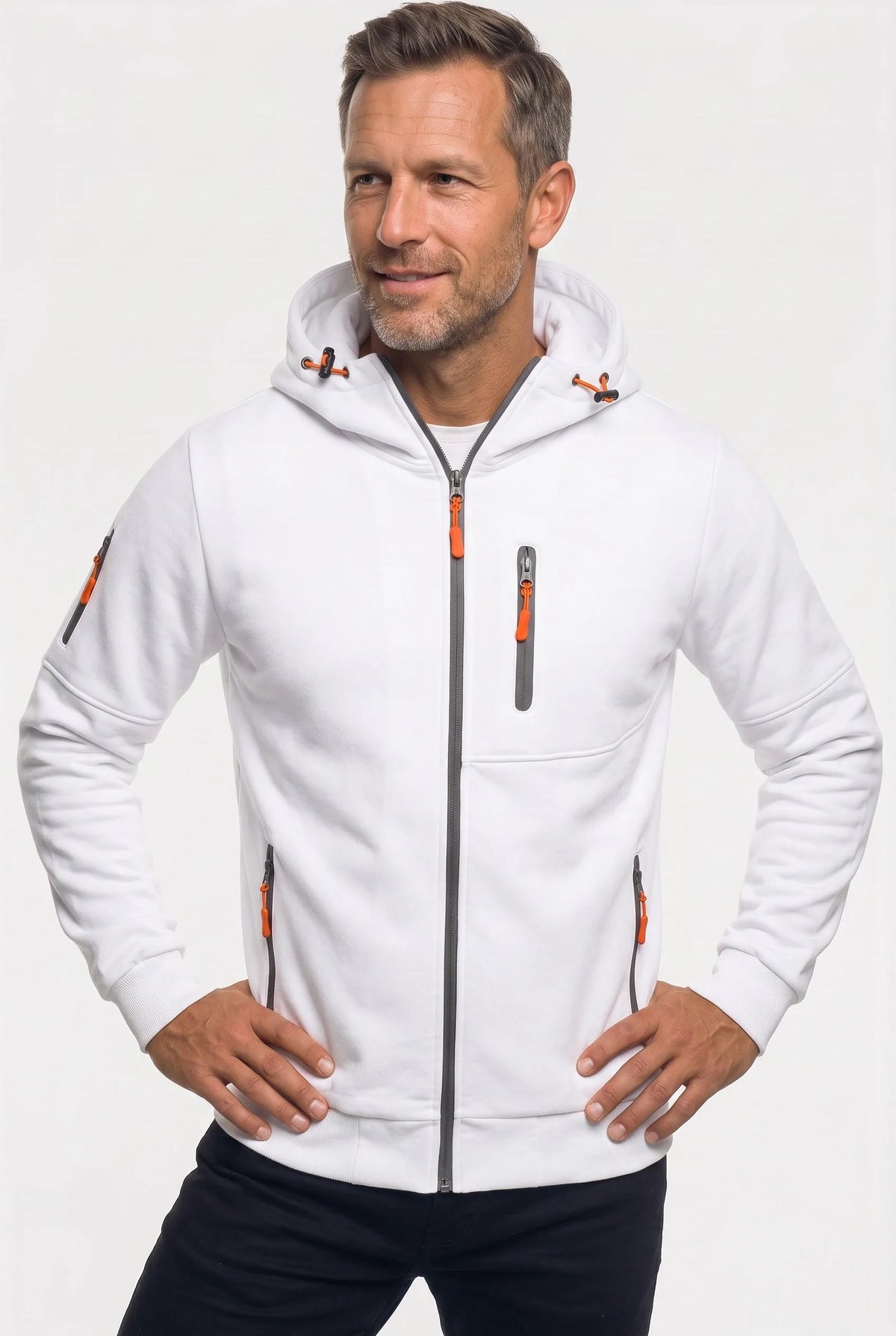 Front view of a man wearing a white full-zip hoodie with grey zip trims and orange zip pulls