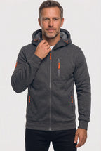 Man wearing a dark grey marl full-zip hoodie with a raised hood and orange zip pulls