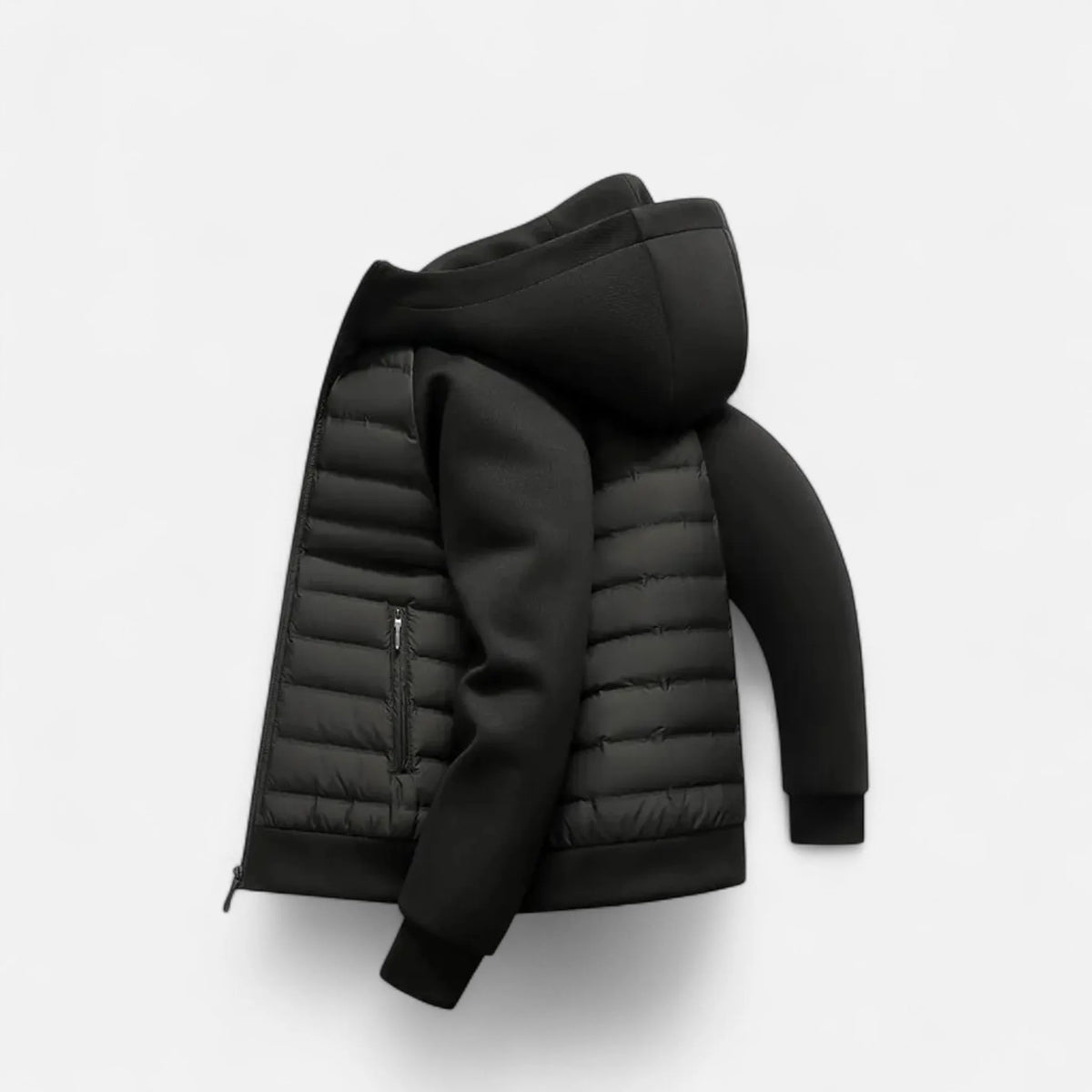 Flat lay side view of the black jacket showing the quilted body and contrast fleece sleeve