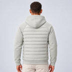 Back view of the light grey hooded puffer jacket showing the fleece hood and quilted panel